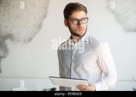 Handsome guy using tablet Stock Photo