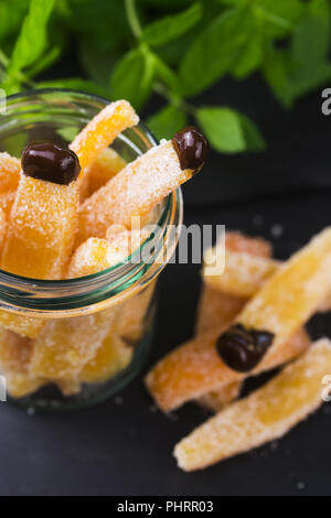 Orange slices in dark chocolate, close-up Stock Photo