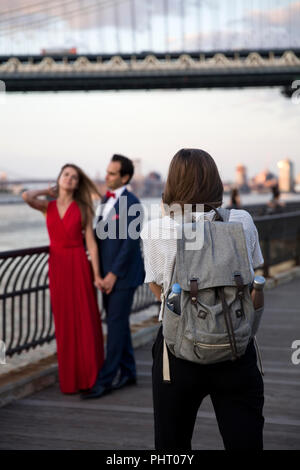 NEW YORK, USA - AUGUST 25, 2017: Unidentified wedding couple at Brooklyn Heights in New York City. Brooklyn Heights is popular wedding photoshooting p Stock Photo