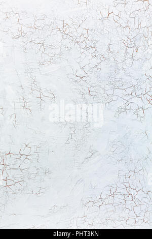 Cracks in the white wall plaster. Stock Photo