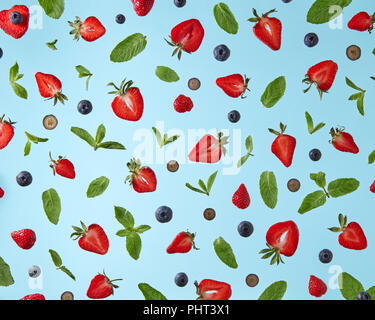 pattern of fresh berries isolated on blue background Stock Photo