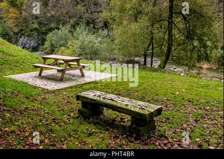 benches and wooden table for picnics in the mountain meadow in autumn Stock Photo