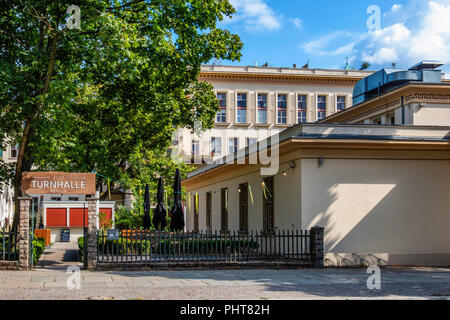 Berlin-Friedrichshain.Alte Turnhalle building exterior. Restaurant & lounge bar with large outside terrace. Listed old gymnasium,converted sports hall Stock Photo