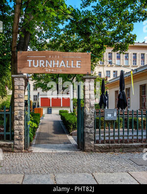 Berlin-Friedrichshain.Alte Turnhalle building exterior. Restaurant & lounge bar with large outside terrace. Listed old gymnasium,converted sports hall Stock Photo
