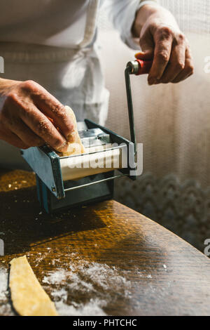 A woman making homemade pastain the traditional way Stock Photo