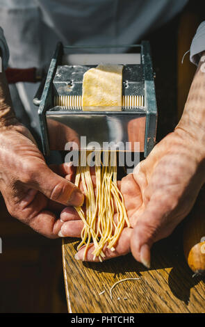 A woman making homemade pastain the traditional way Stock Photo