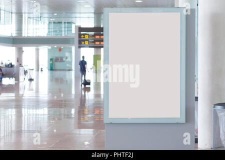 Blank billboard mock up in an airport, with unfocused background Stock Photo