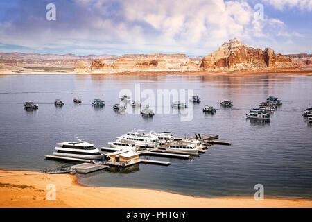 Boats dock at a marina on Lake Powell near Page, Arizona. Stock Photo