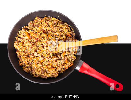 assorted cooked rice with vegetables in a frying pan Stock Photo