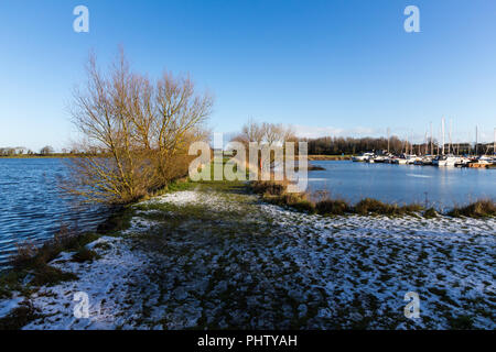 Grass walkway covered in light snow at Kinnego Marina, Oxford Island, N.Ireland. Stock Photo