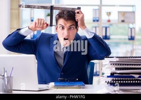 Stressed businessman thinking of suicide due to excessive worklo Stock Photo