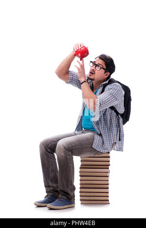 Young student sitting on top of book stack on white Stock Photo