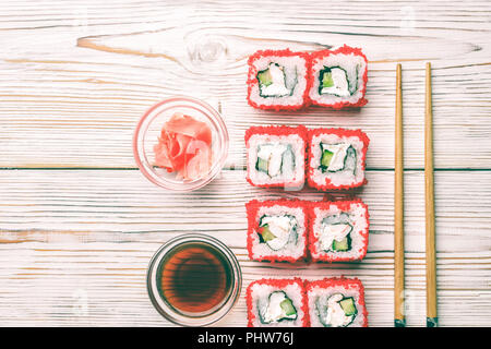 Set of sushi rolls of fresh shrimps cucumber avocado Tobiko caviar and Philadelphia Stock Photo