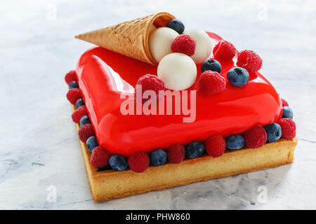 Modern mousse cake with red glaze. Stock Photo