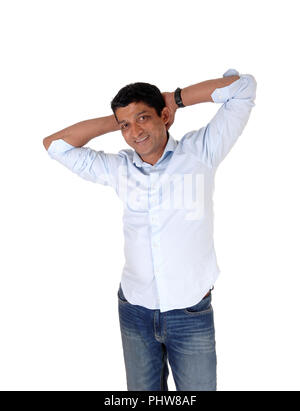 Smiling and happy East Indian man standing Stock Photo