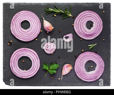 Sliced red onions set on black Stock Photo