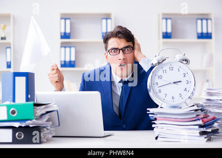 Businessman throwing white flag and giving up Stock Photo