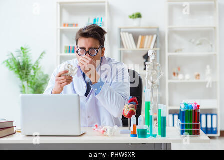 Funny doctor having fun in hospital lab Stock Photo