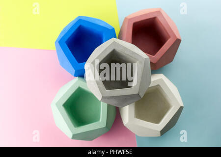 concrete pot for plants ,empty ,polygonal shape,bright background Stock Photo