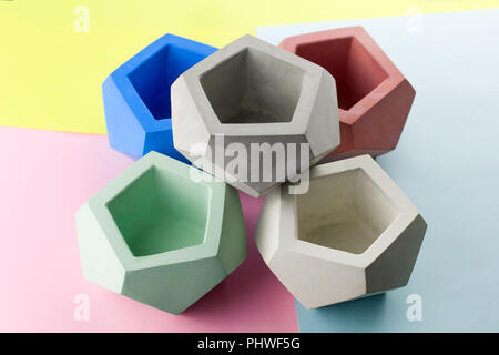 concrete pot for plants ,empty ,polygonal shape,bright background Stock Photo