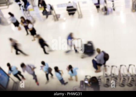 Large group of peoples in the airport in Motin blur concept