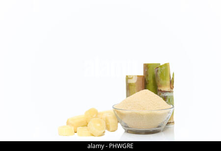 Brown Sugar in bowl and stump of sugar cane Stock Photo