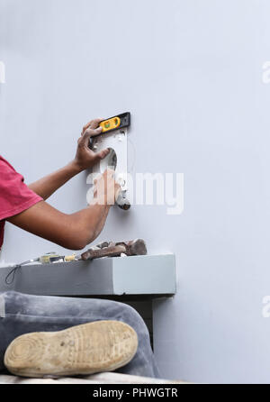Unidentified builder making construction for ventilation Stock Photo