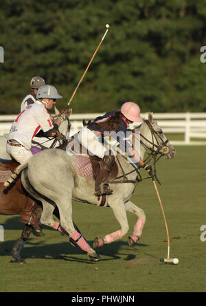 A woman polo player competes in the annual England vs. USA match at