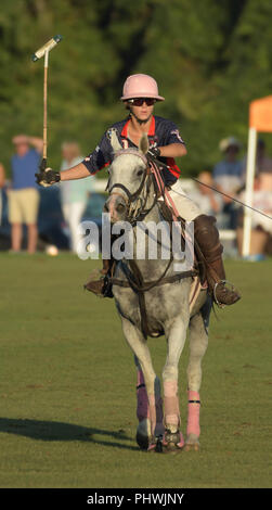 A woman polo player competes in the annual England vs. USA match at