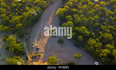 Tourists camping in a dry river, Cunene Province, Oncocua, Angola Stock Photo