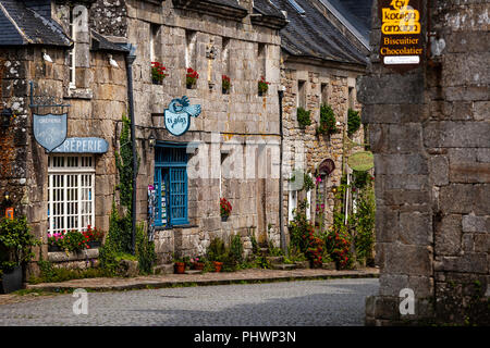 A small cobbled street with creperie in the ancient town of Locronan Brittany France Stock Photo