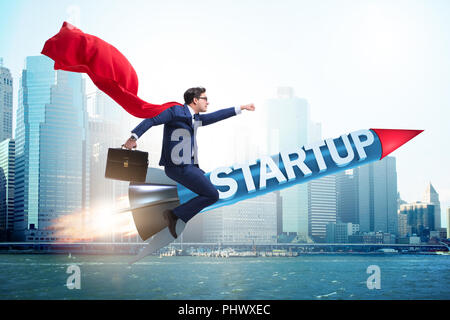 Superhero businessman in start-up concept flying rocket Stock Photo - Alamy