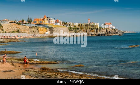 Estoril, Portugal - August 30th, 2018: Families on beach at Poca Beach in Sao Joao do Estoril, 25km west of Lisbon Stock Photo