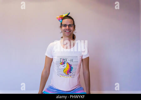 LGBT portrait joyful funny transgender girl dressed in unicorn outfit Stock Photo