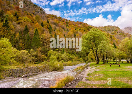 Autumn landscape on the Alps of a stream among nature, mountains in picnic area, Bergamo, Orobie, Valley brembana resort Cassiglio Stock Photo