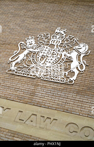 UK royal Coat of arms on wall outside of Salisbury law courts Stock Photo