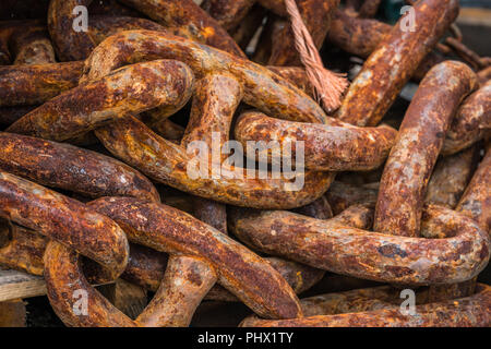 Pile of old heavy rusty chain links Stock Photo