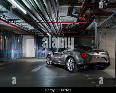 Shiny grey super sports car in garage waiting for next adventure Stock Photo