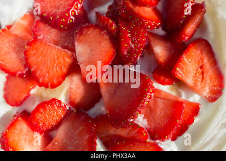 Sliced strawberries on greek yogurt Stock Photo