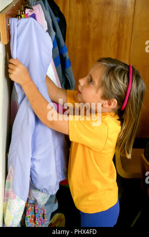 Kid Hanging Coat Photos, Images and Pictures