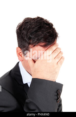 Business man covering is face he is depressed Stock Photo