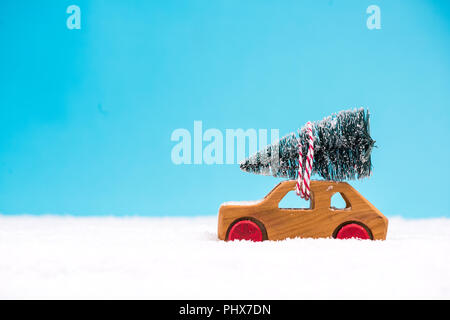 Toy car with Christmas tree. Stock Photo