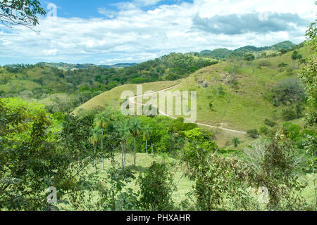 Monteverde National Park, Costa Rica, Central America.  Winding dirt road in beautiful scenery in the park. Stock Photo