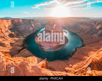 Sun setting behind the horseshoe bend Stock Photo