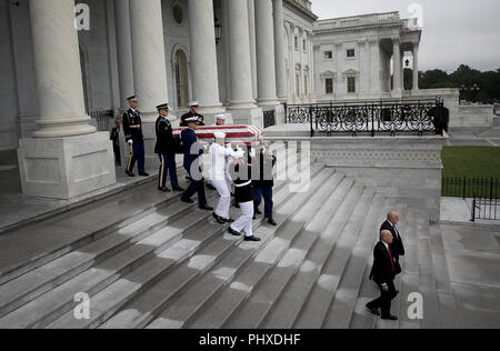 Washington, District of Columbia, USA. 1st Sep, 2018. WASHINGTON, DC - SEPTEMBER 01: A military honor guard team carries the casket of the late-Sen. John McCain (R-AZ) from the U.S. Capitol September 1, 2018 in Washington, DC. The late senator died August 25 at the age of 81 after a long battle with brain cancer. Sen. McCain will be buried at his final resting place at the U.S. Naval Academy on Sunday. Credit: Win McNamee/Pool via CNP Credit: Win Mcnamee/CNP/ZUMA Wire/Alamy Live News Stock Photo