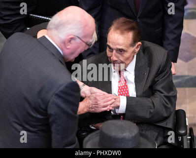 Washington, United States Of America. 01st Sep, 2018. Former United States Senator Bob Dole (Republican of Kansas), right, is welcomed by US Senator Patrick Leahy (Democrat of Vermont) prior to the funeral service for the late US Senator John S. McCain, III (Republican of Arizona) at the Washington National Cathedral in Washington, DC on Saturday, September 1, 2018. Credit: Ron Sachs/CNP (RESTRICTION: NO New York or New Jersey Newspapers or newspapers within a 75 mile radius of New York City) | usage worldwide Credit: dpa/Alamy Live News Stock Photo