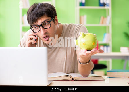 Young student in expensive tuition concept Stock Photo