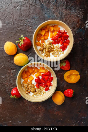 Homemade yogurt with granola, apricot and pine nuts Stock Photo