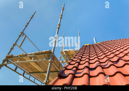 New roof with scaffolding and blue sky Stock Photo