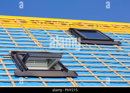 Two roof windows on the roof of a new house Stock Photo